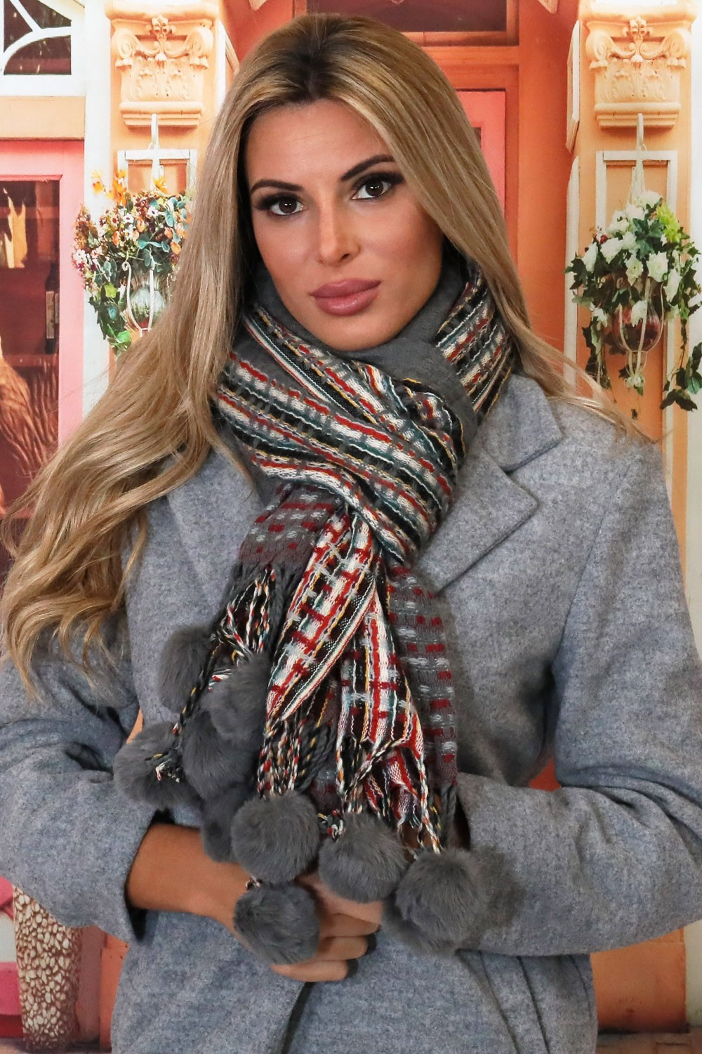 Bufanda de lana con pompones